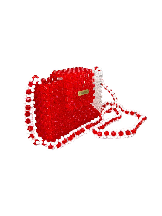 Red beaded handbag with a strap on a white background